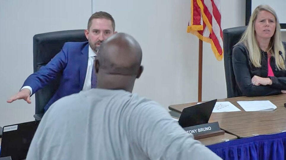  Tempers flare after board votes 5-2 on settlement with Boozer