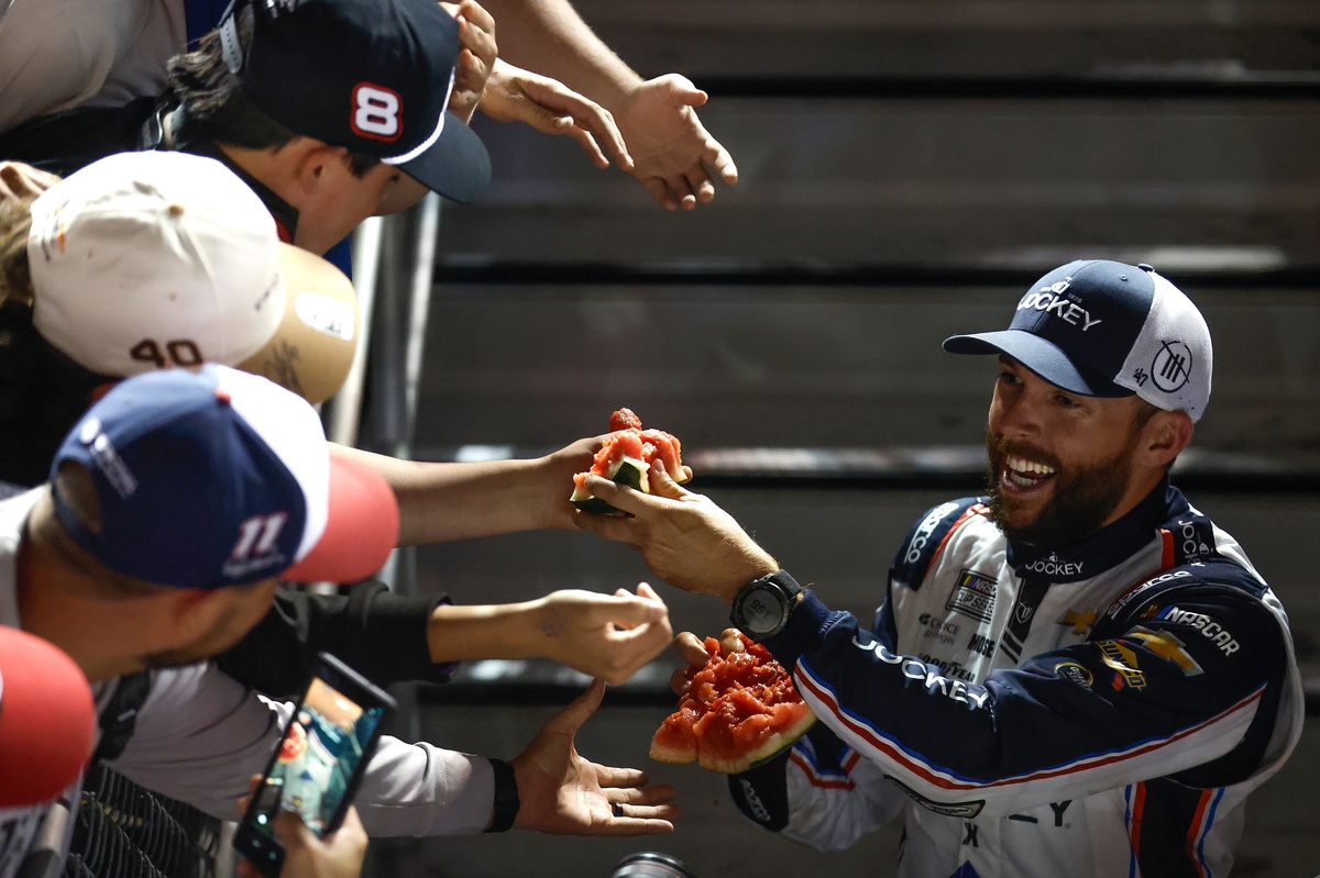 Ross Chastain stops fan who reached into his car and stole his hat after Coke 600 win