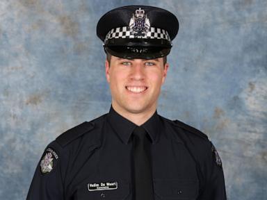 Australian police identify suspect in fatal shooting of officers as search enters second day