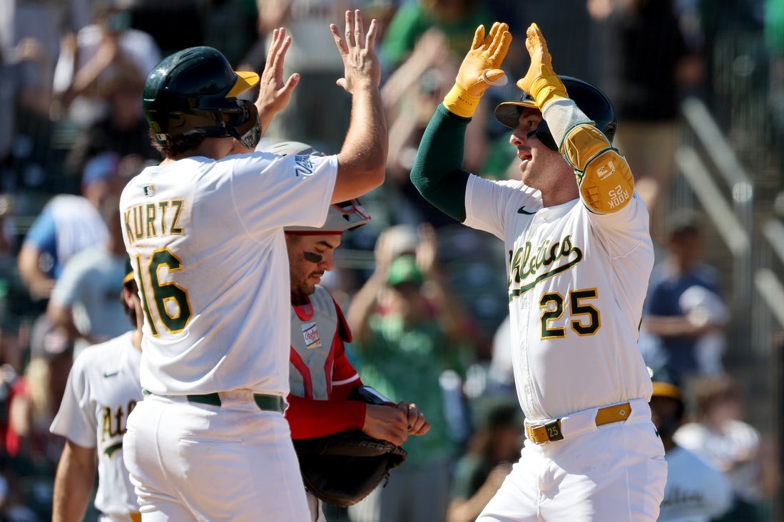 Four homers help Athletics complete sweep of Reds