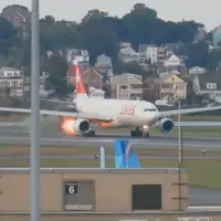 Flight departing from Boston puts on the brakes after spitting out flames