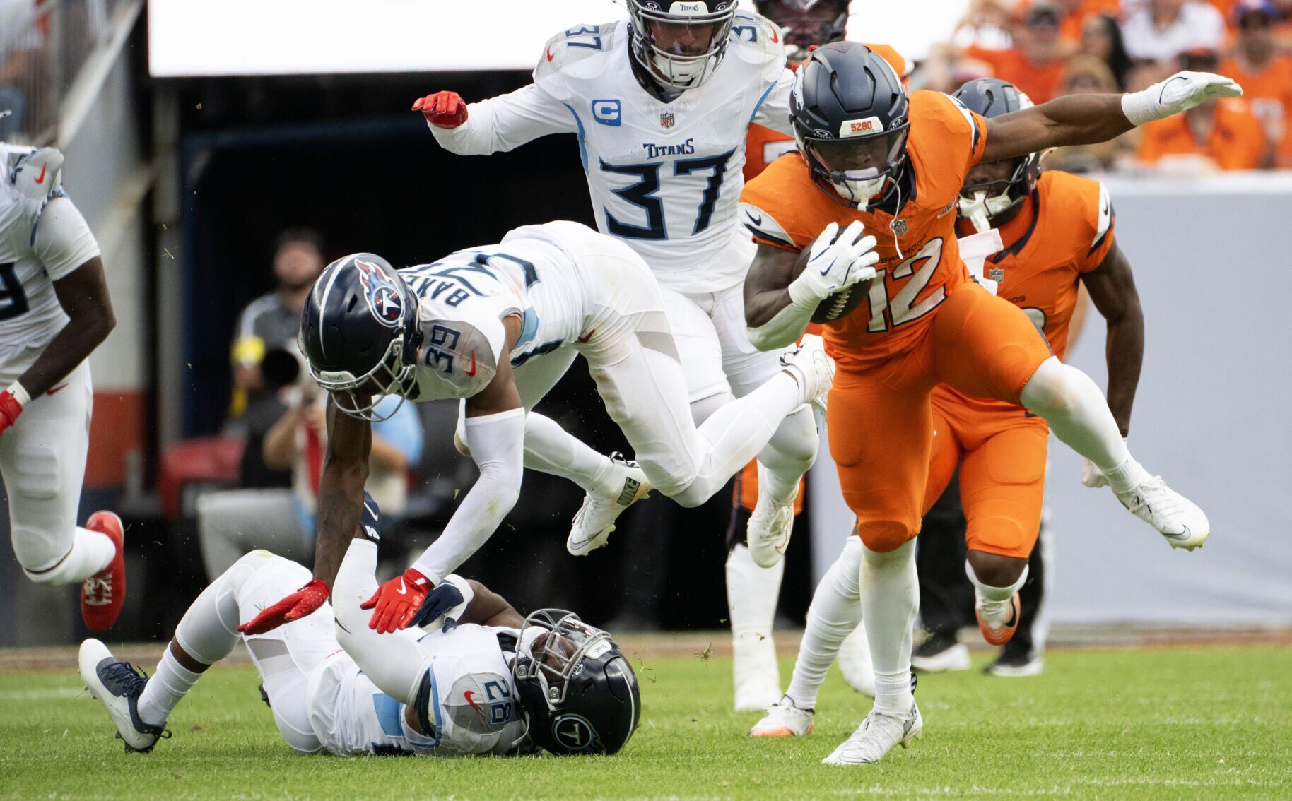 Broncos vs. Titans grades: Denver’s defense steals the show in opening win