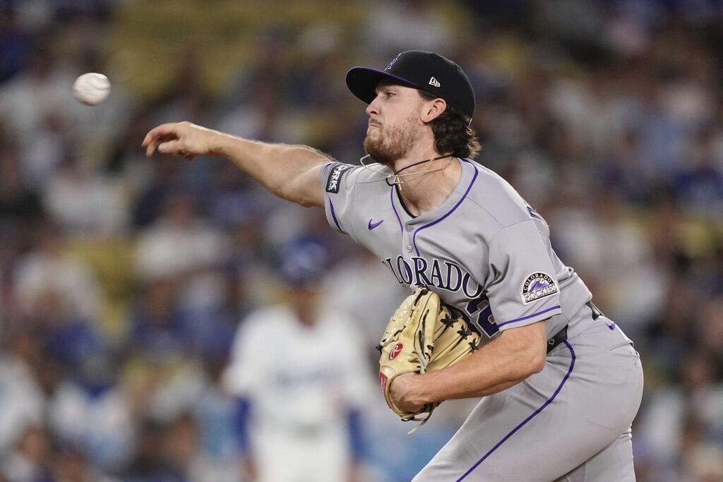  Rockies starter Chase Dollander reacts in San Diego to season-ending injury