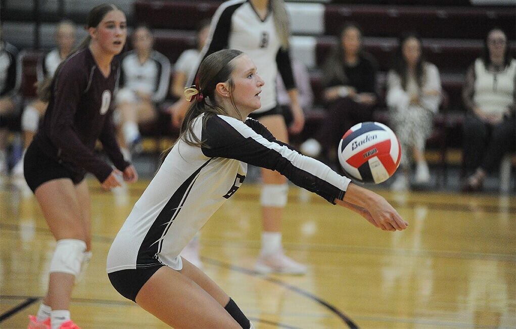 Manhattan Christian overcomes own miscues to sweep Twin Bridges in league match