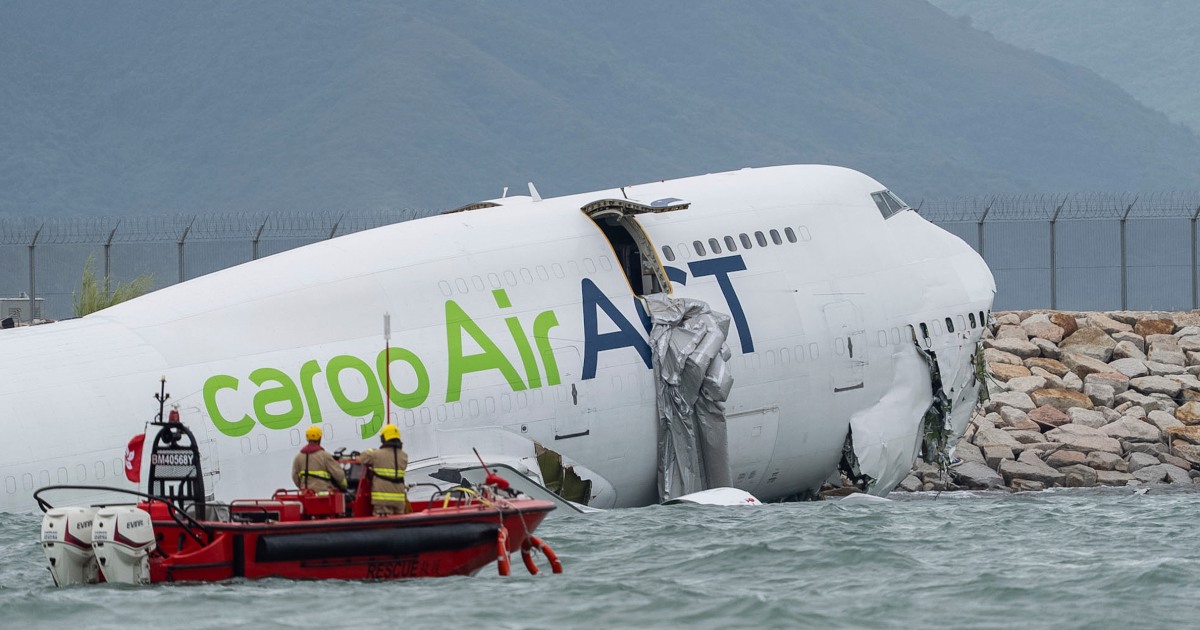 Two ground staff killed at Hong Kong airport after cargo plane and vehicle go into the sea