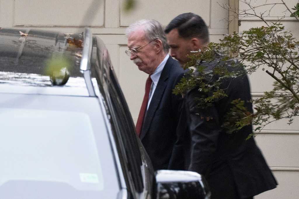 Bolton arrives at court to surrender to authorities on charges in classified information case