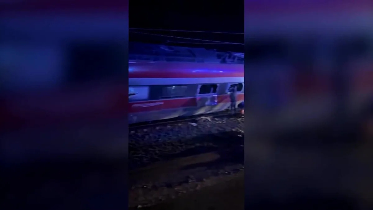 People escape from windows after two trains derail in Spain