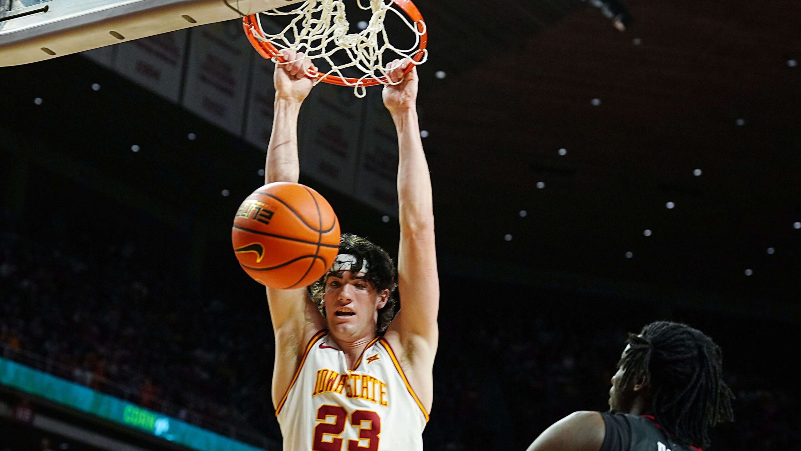 Iowa State Cyclones forward Blake Buchanan (23) dunks the ball around Texas Tech Red Raiders forward Luke Bamgboye (9) during the first half in the Big-12 conference men’s basketball showdown on Feb. 28, 2026, at Hilton Coliseum in Ames, Iowa.