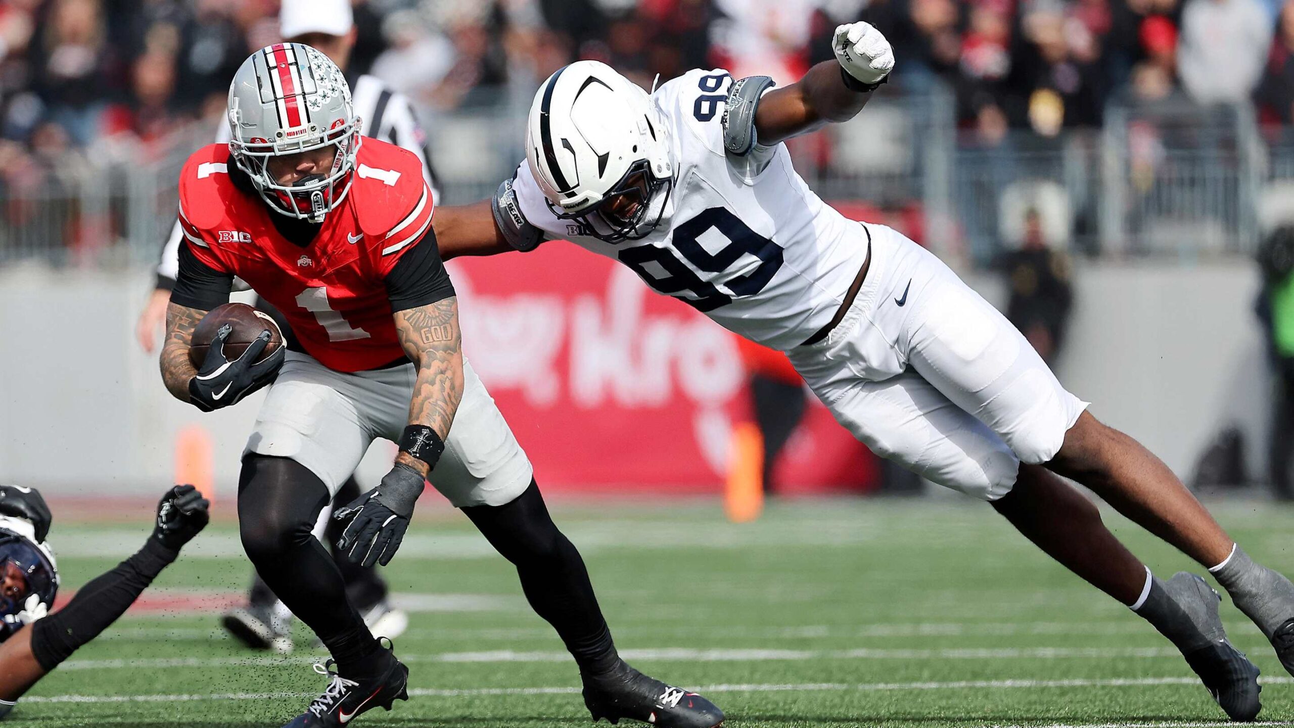 Penn State Nittany Lions defensive end Yvan Kemajou dives for the tackle vs. Ohio State Buckeyes receiver Brandon Inniss.