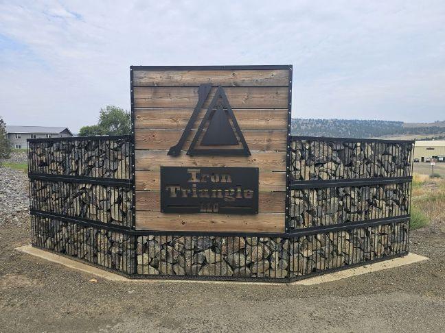 John Day agrees to settlement with Iron Triangle