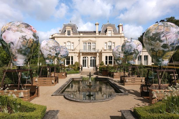 Whimsical Surrey courtyard turns into romantic outdoor restaurant with six stationary hot air balloon tables