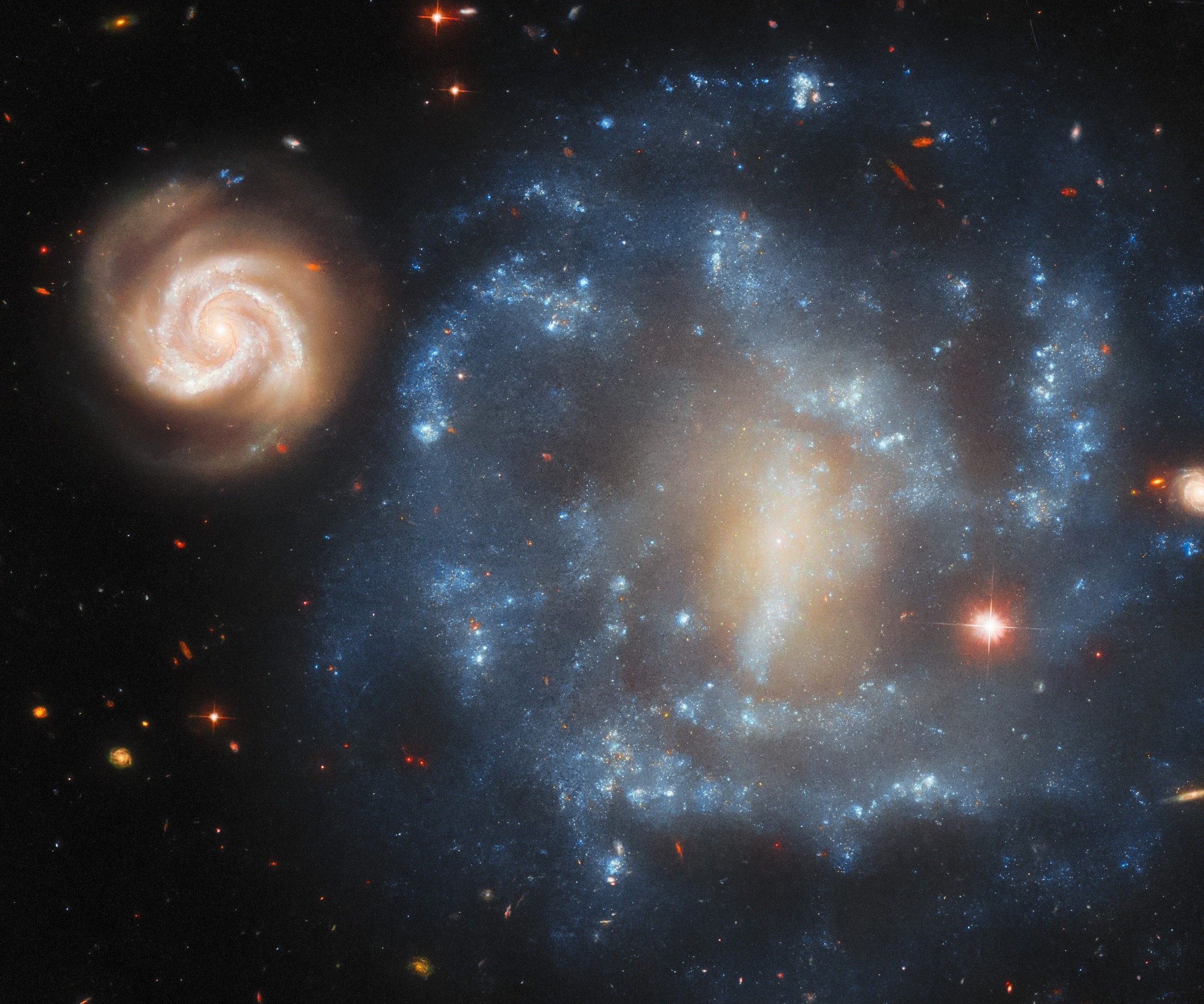Galaxy pair forms a rare optical illusion in deep space