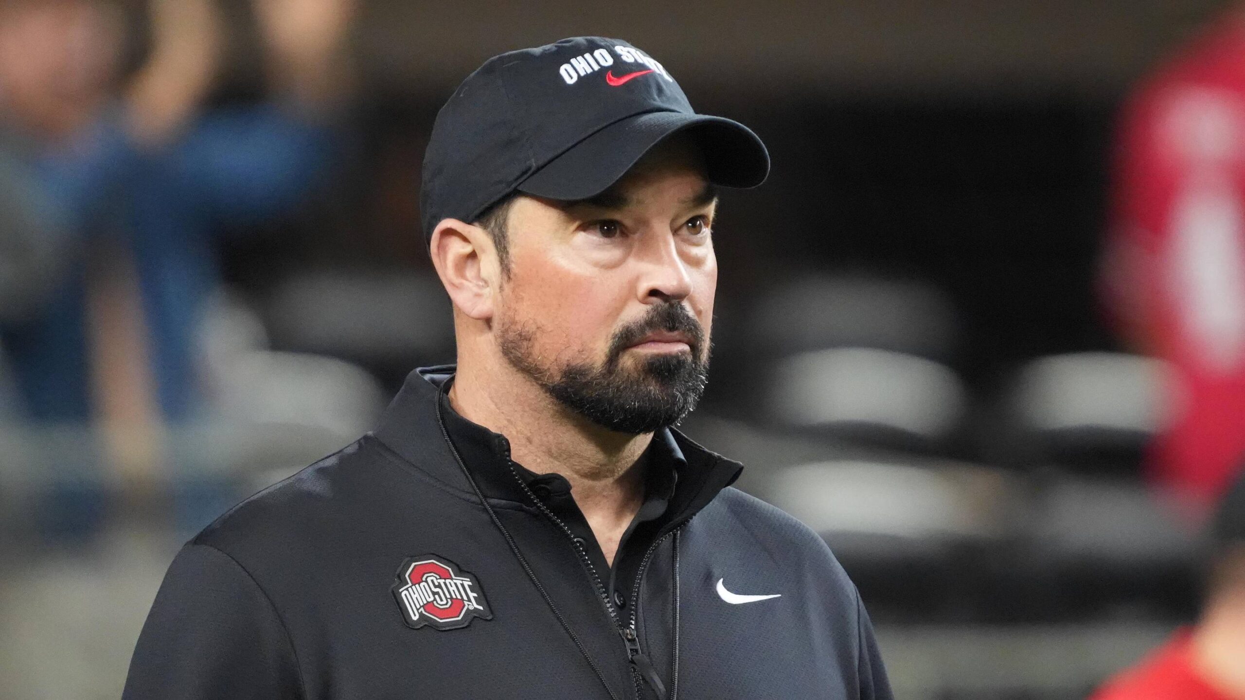 Ohio State Buckeyes head coach Ryan Day looks on during warm ups before the 2025 Cotton Bowl and quarterfinal game of the College Football Playoff at AT&T Stadium.