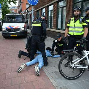 Soccer fans clash with police in The Hague after Morocco stuns the Netherlands at the World Cup