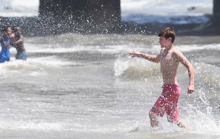 Sweltering heat dome threatens U.S. holiday plans, power grids