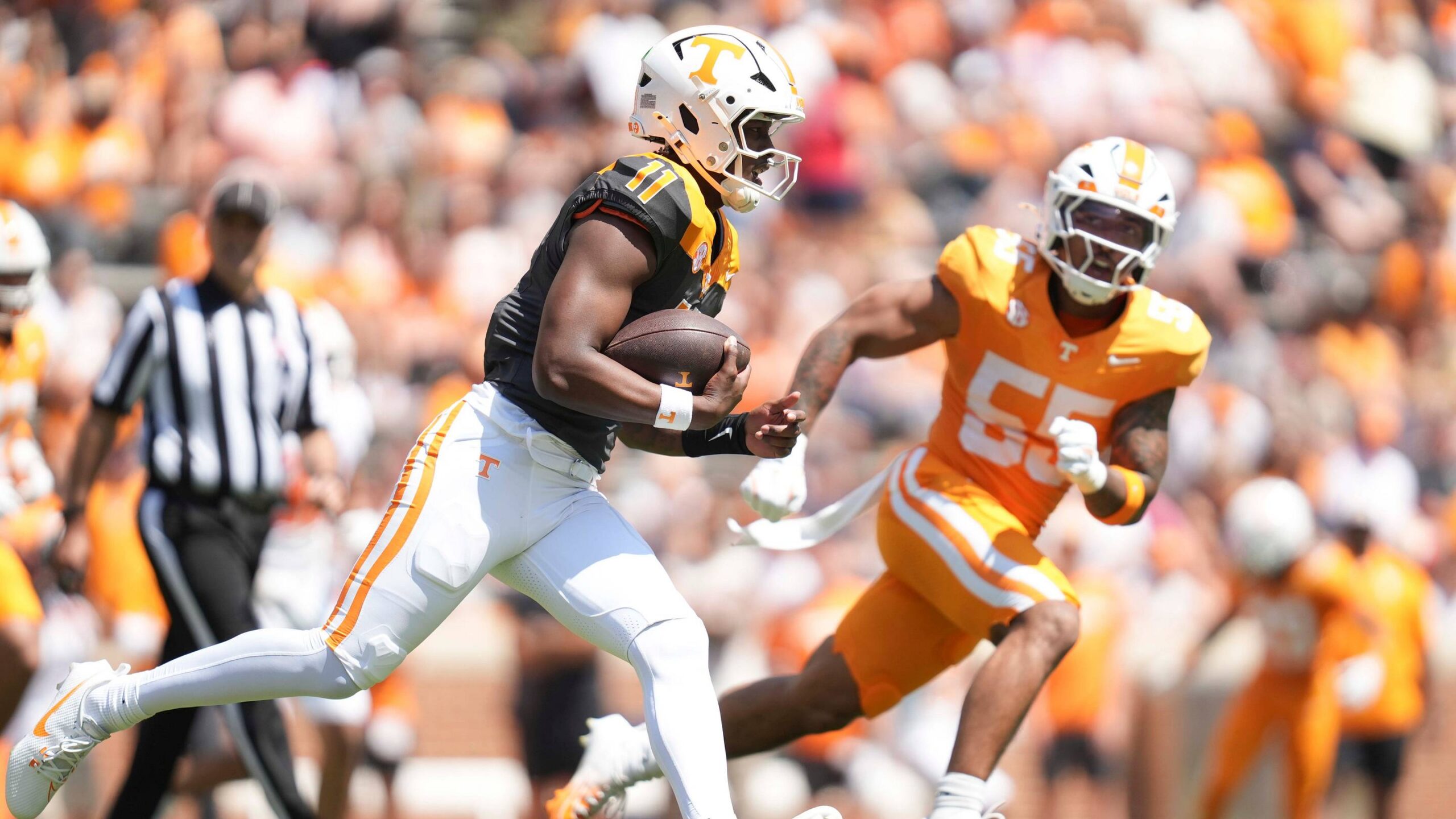 Tennessee quarterback Faizon Brandon (11) scrambles with the ball during the Orange and White game at Neyland Stadium in Knoxville, Tennessee, April 11, 2026.