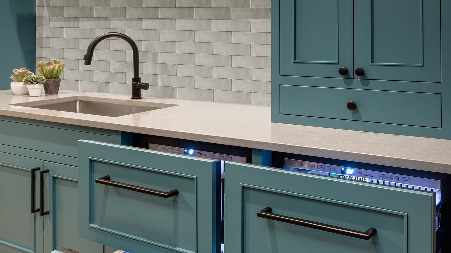 It’s not that these kitchens skipped the beverage fridge, they hid it where almost no one thinks to look